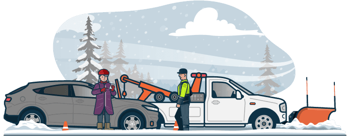 A roadside assistance technician uses a winch out to help a motorist stuck in the snow.